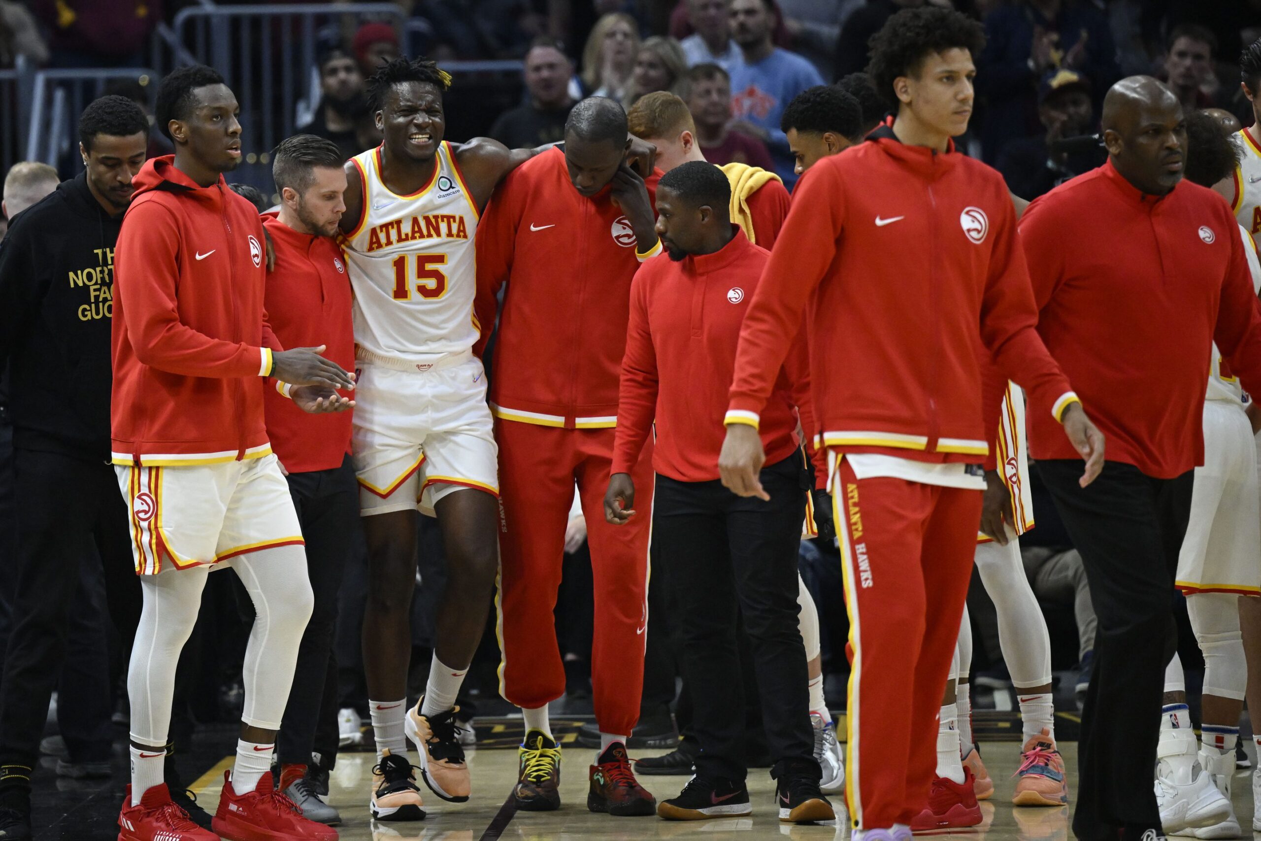 Atlanta Hawks center Clint Capela (15) is helped off the court