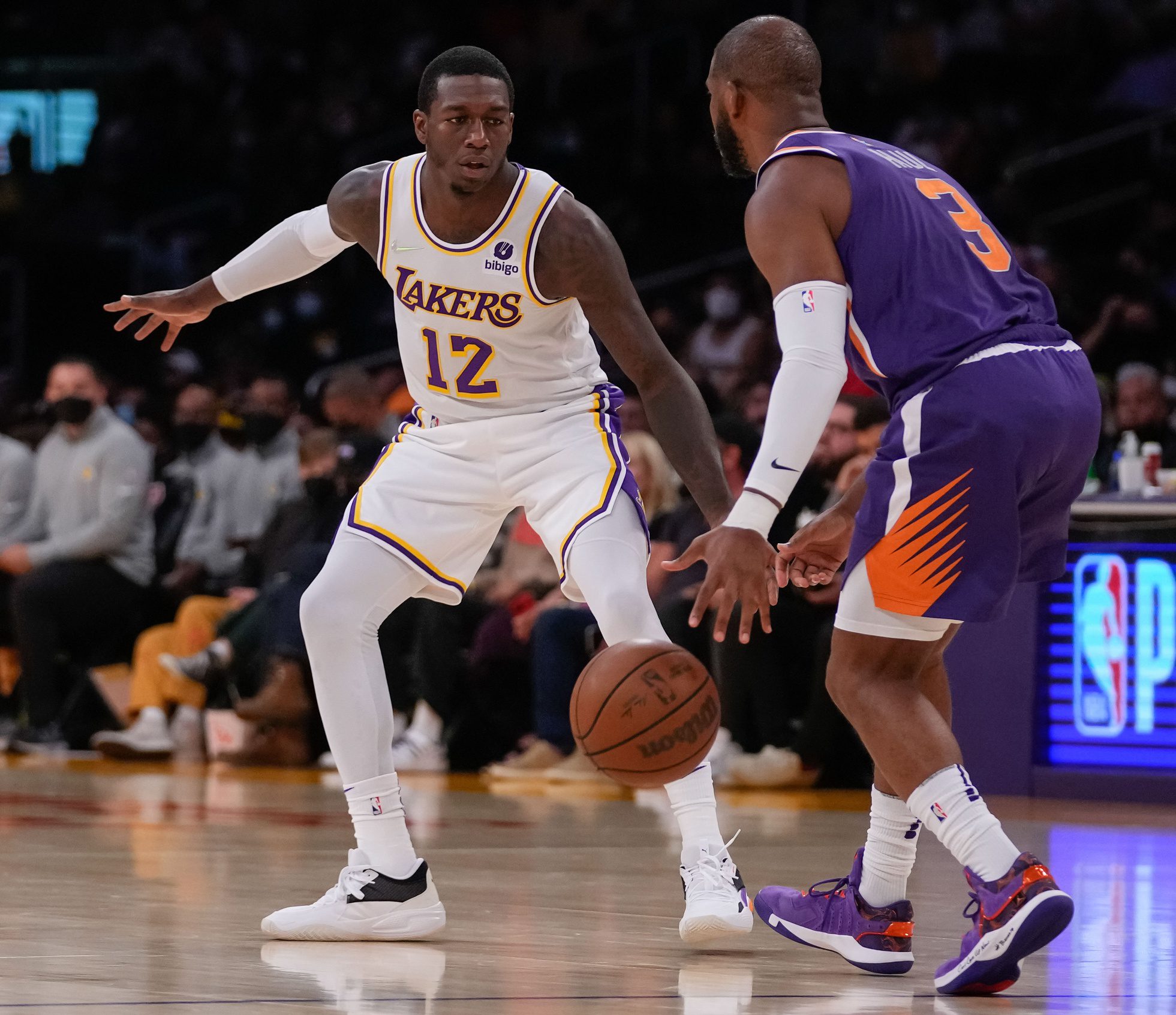 Los Angeles Lakers guard Kendrick Nunn defends Phoenix Suns guard Chris Paul