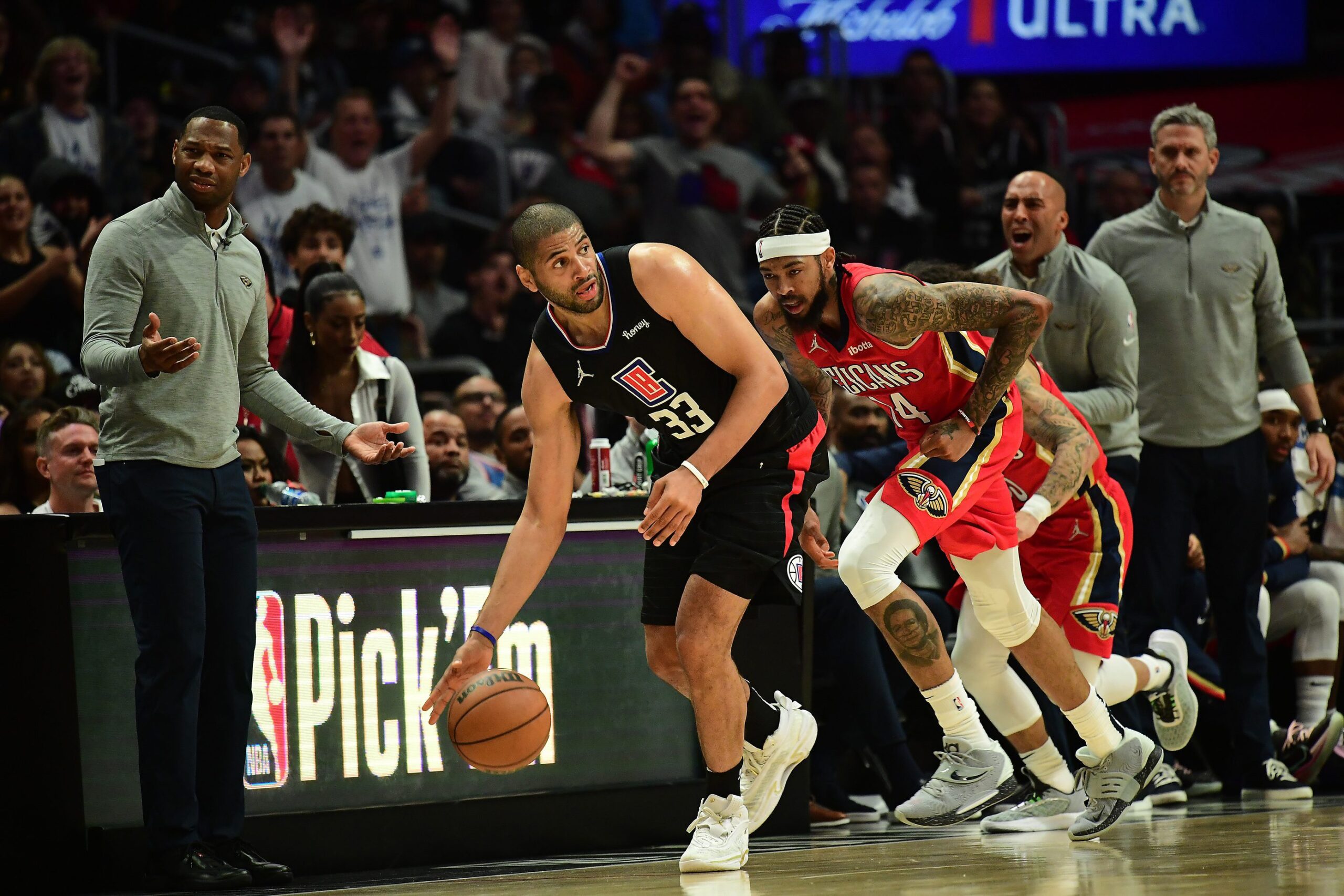 Los Angeles Clippers forward Nicolas Batum gets the ball away from New Orleans Pelicans forward Brandon Ingram